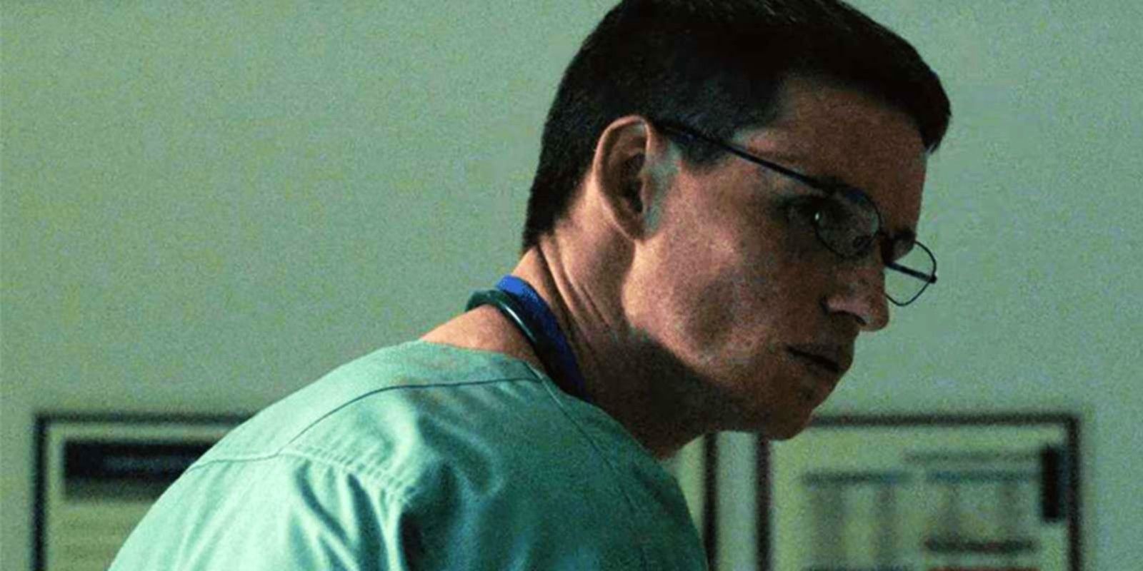 Eddie Redmayne as Charles Cullen looking over his shoulder in The Good Nurse.